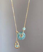Collar con colgante de calabaza de calcedonia dorada en plata de ley azul con hebilla de seguridad